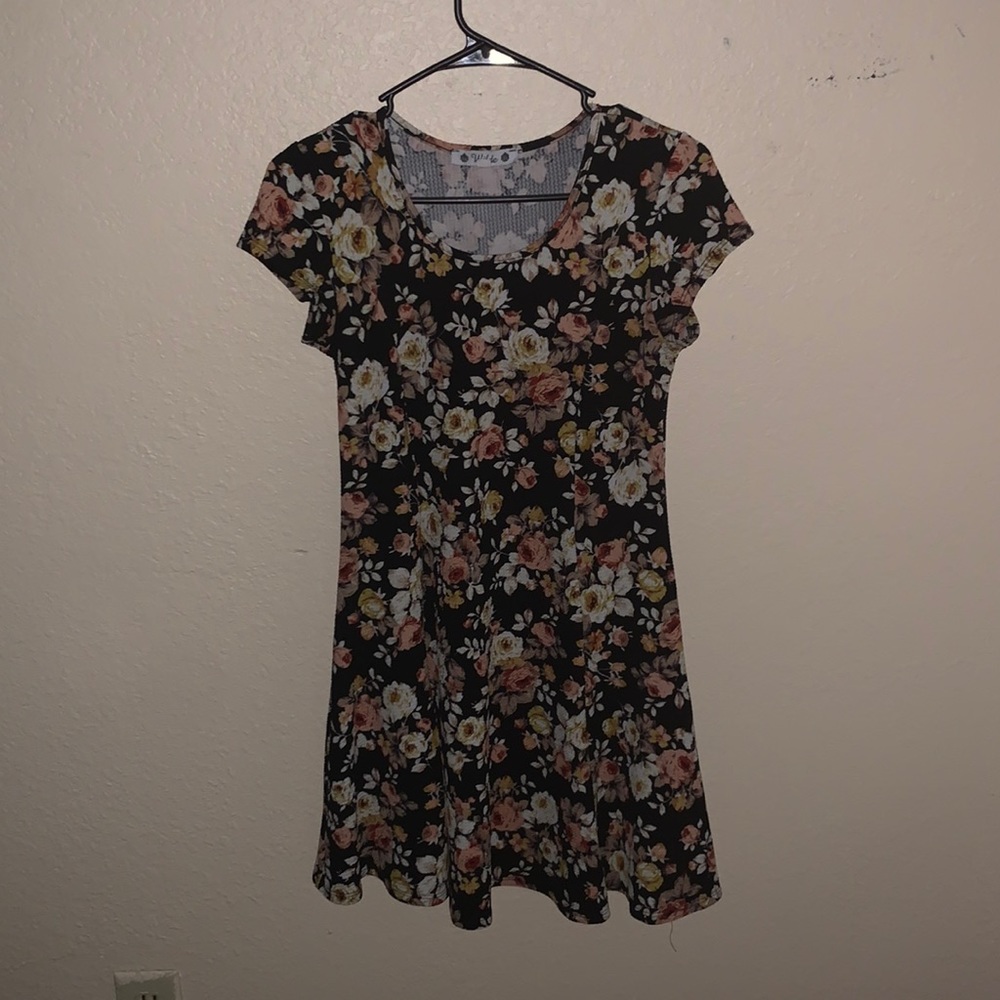 It is a small and the colors consist of black, off white, and peach.